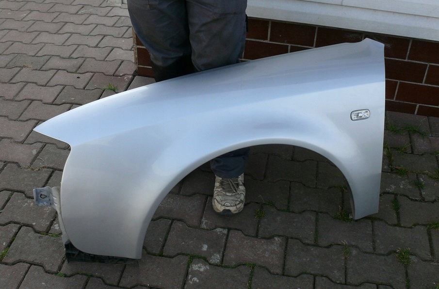 BŁOTNIK LEWY PRZÓD AUDI A6 C5 LIFT LY7W ORYGINAŁ