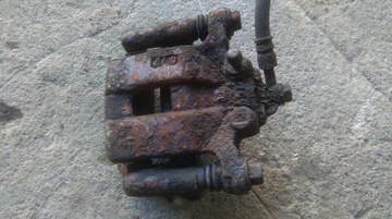 Nissan x-trail t30 суппорт тормозной левый зад задний фото №1