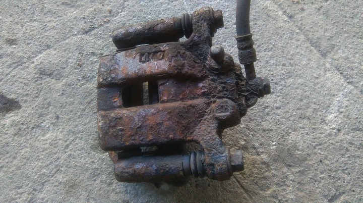 фото №1, Nissan x-trail t30 суппорт тормозной левый зад задний