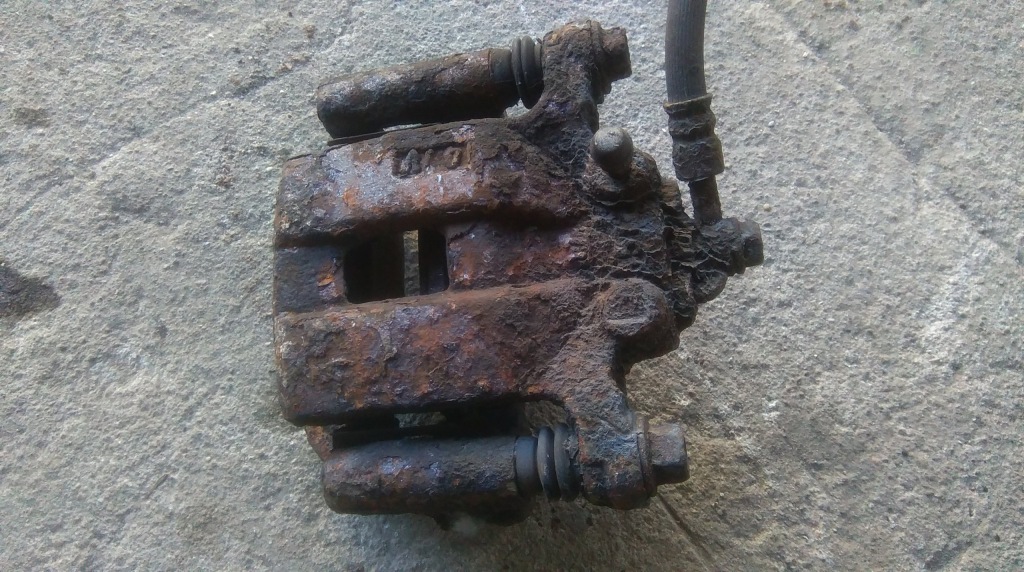 фото №1, Nissan x-trail t30 суппорт тормозной левый задняя задний